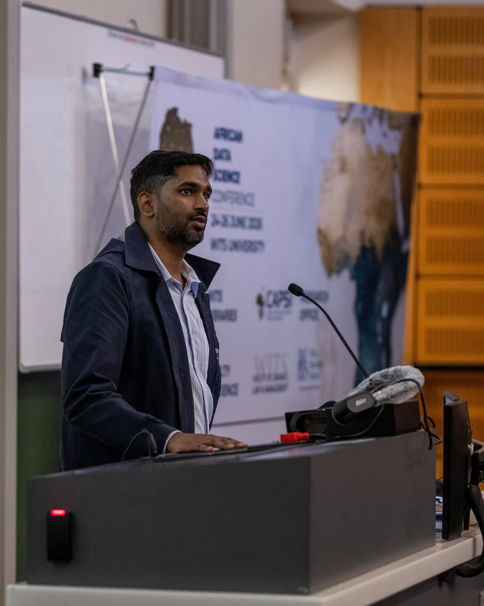 Dr Cameron Gramanie speaking at a lectern